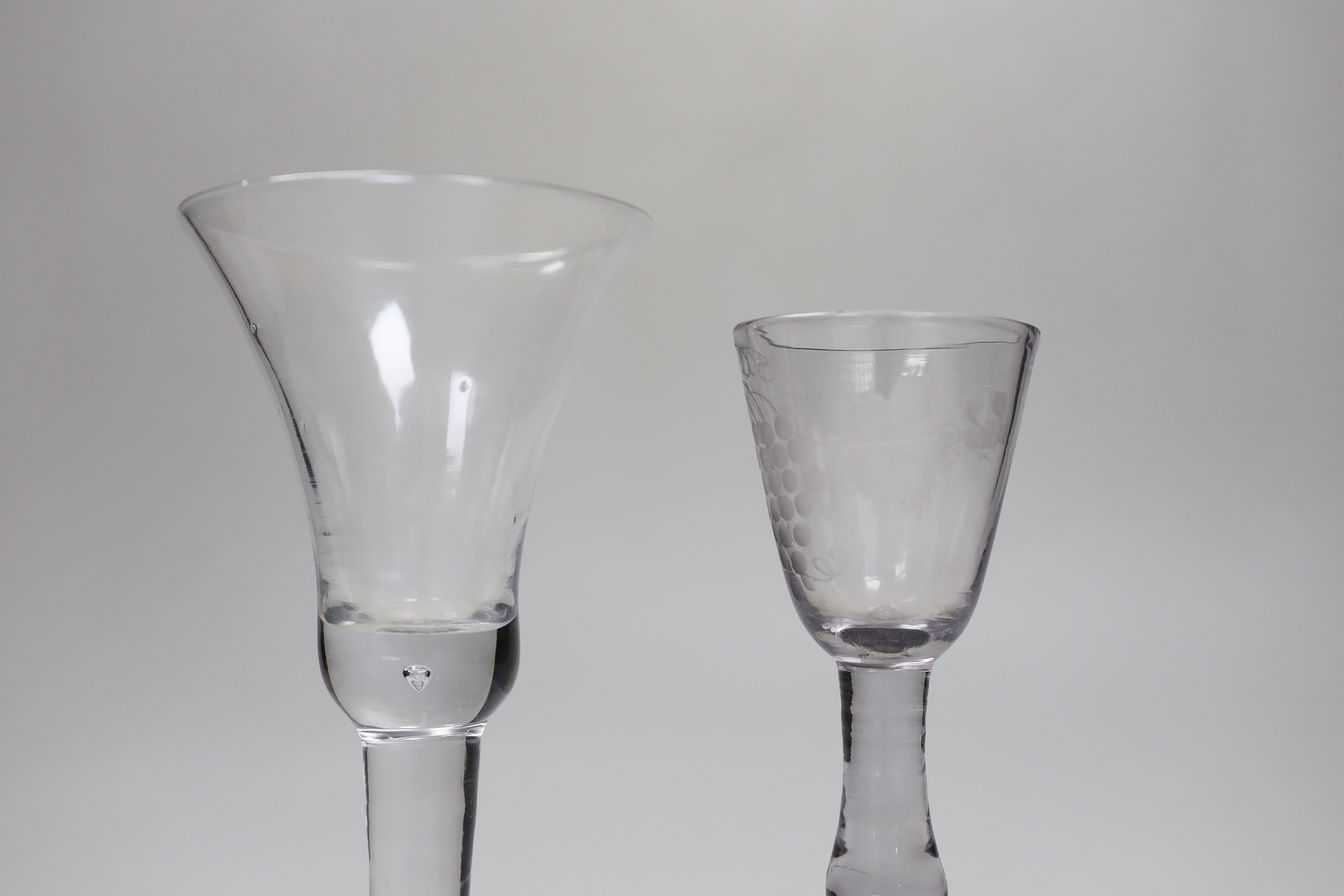 A George II wine glass, domed foot and a George II wine glass, folded foot, largest 16.5cm high